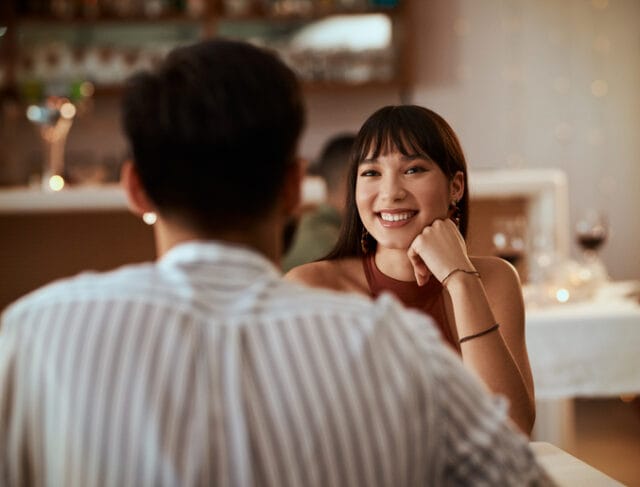 woman smiling on dinner date