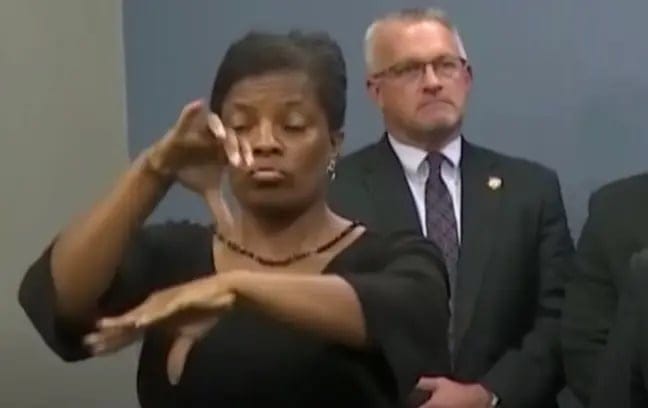 ‘Fraud’ Sign Language Interpreter Starts Doing Random Things On Camera