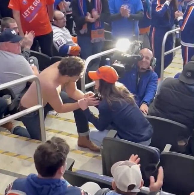 Man Savagely Turned Down After Topless Proposal At Hockey Game
