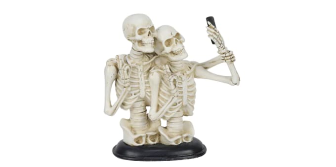 This Statue Of Skeletons Taking A Selfie Is Halloween Decor Done Right