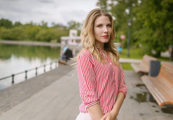 Outdoors portrait of beautiful young woman. Selective focus.