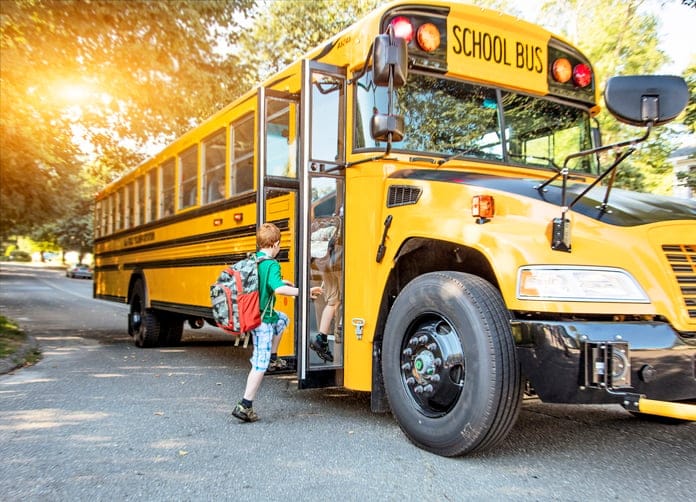 Heartwarming Photo Shows Bus Driver Holding Upset Boy’s Hand On First Day Of School