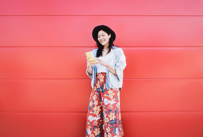 happy woman on phone outside