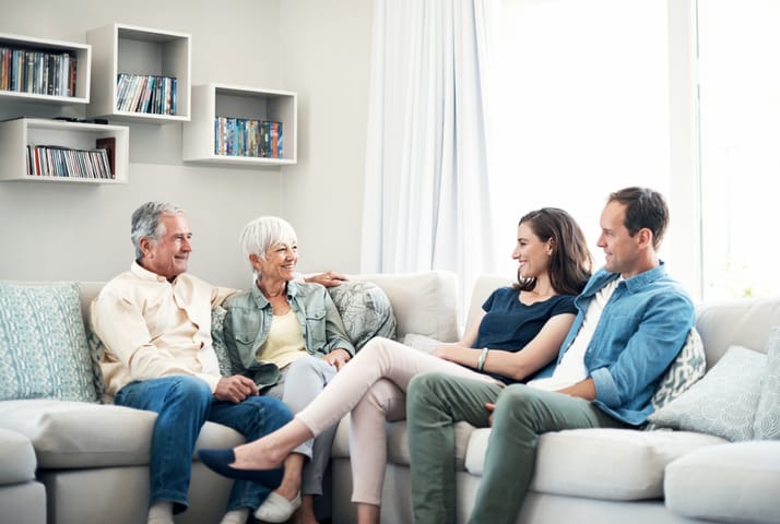 family of four sitting together