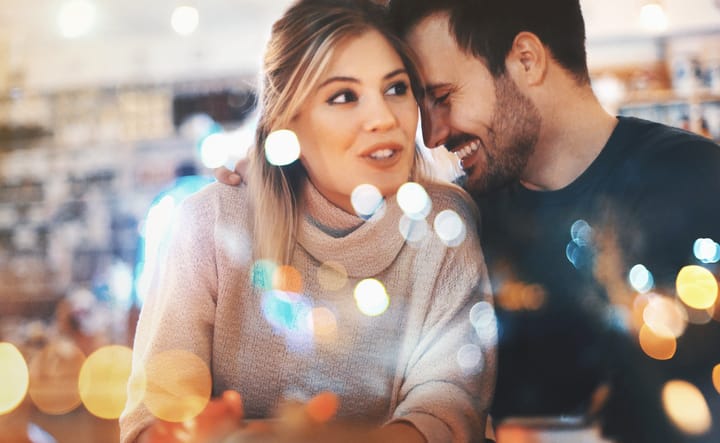 Couple having fun at coffee house.