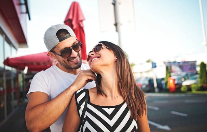 man giving girlfriend necklace