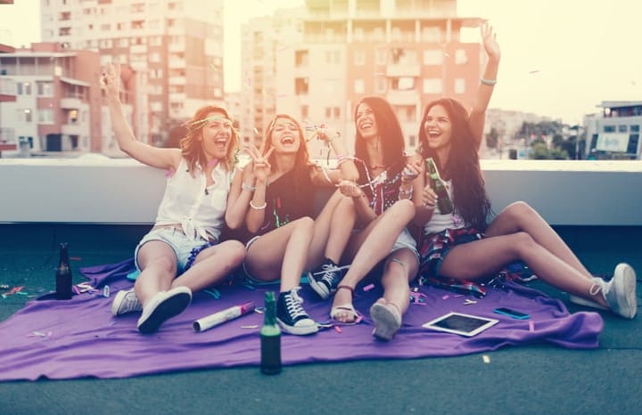 Teenage girls on a rooftop party