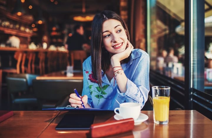 Young student studying in a cafe.