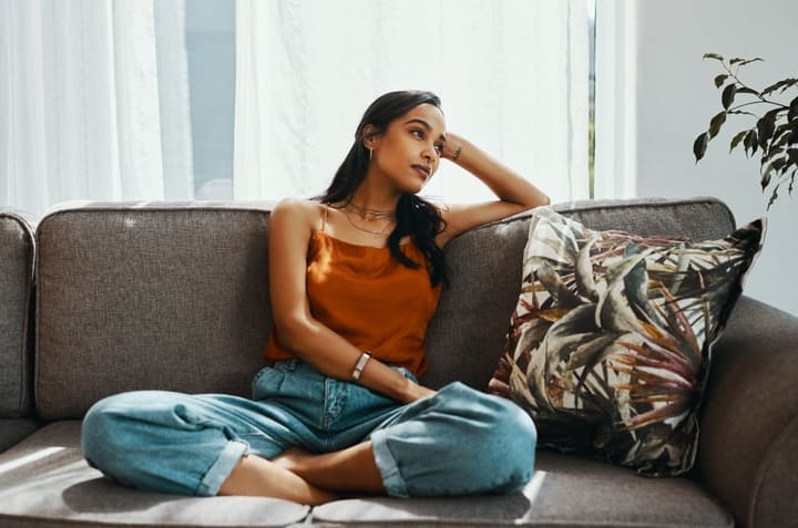 woman sitting alone on the couch