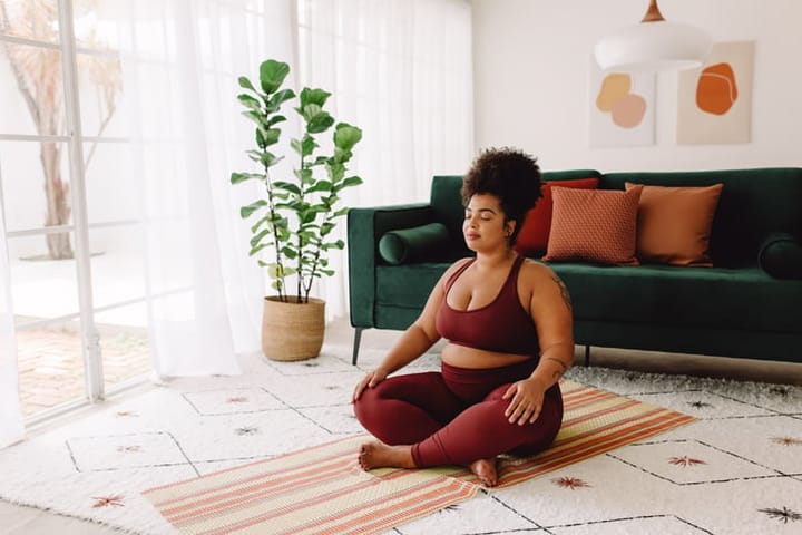 plus size woman doing meditation