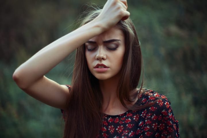 Portrait of young worried woman