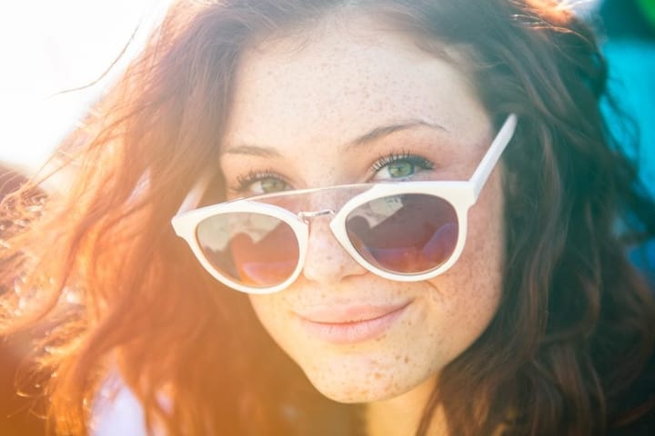 beautiful woman with freckles smiling