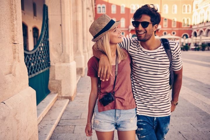 couple walking summer tourism