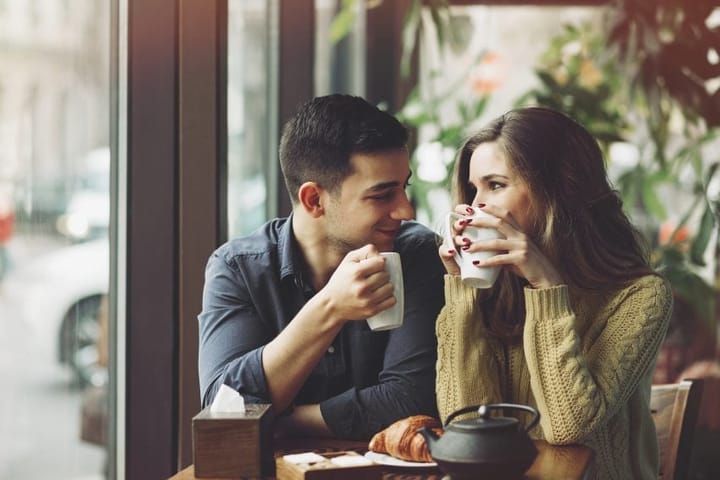 couple date smiling coffee