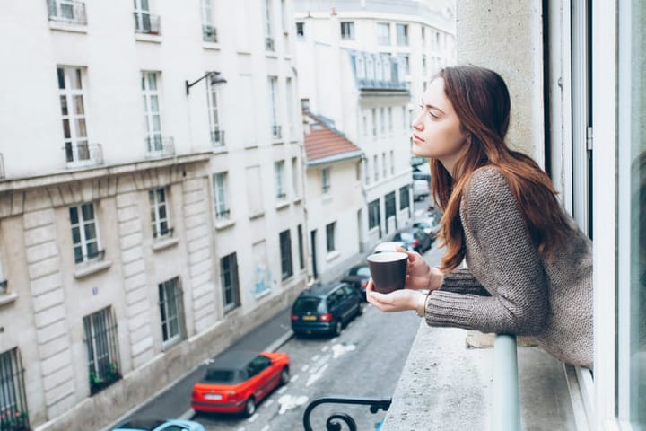 woman city window coffee
