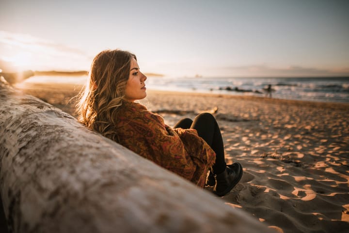 pensive woman at beach