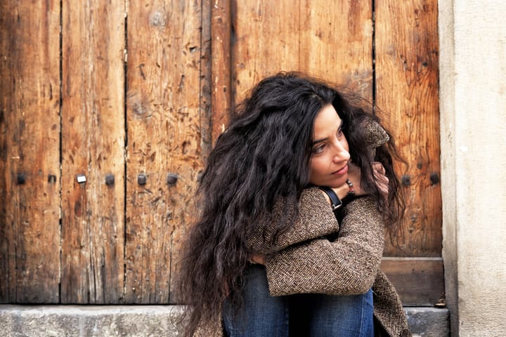 pensive woman portrait outdoors