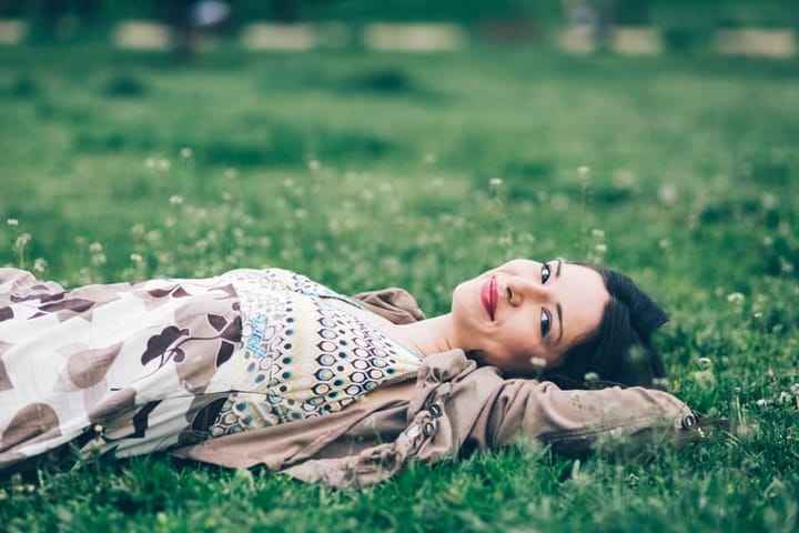 Young woman relaxing in the grass