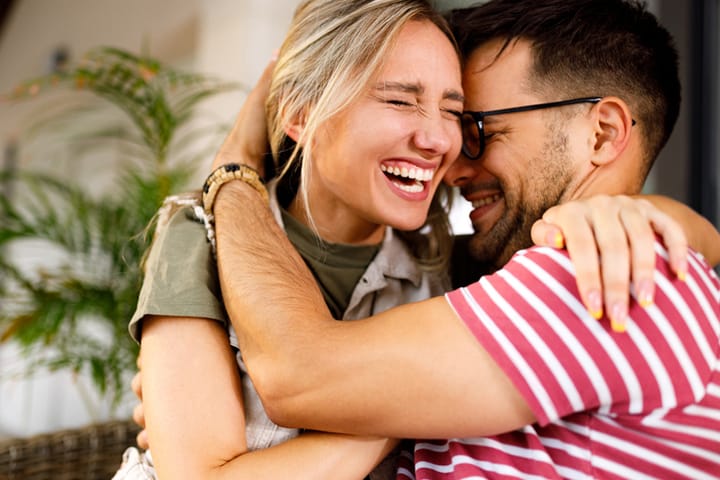 couple laughing and embracing
