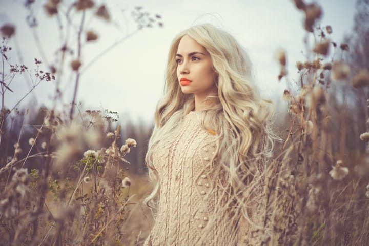 Outdoor fashion photo of young beautiful lady in autumn landscape