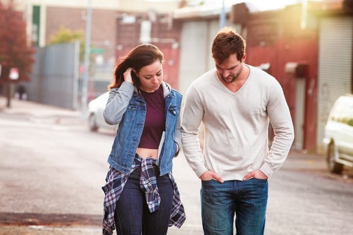Young couple discussing relationship difficulties in an American urban setting. Photographed in Brooklyn.