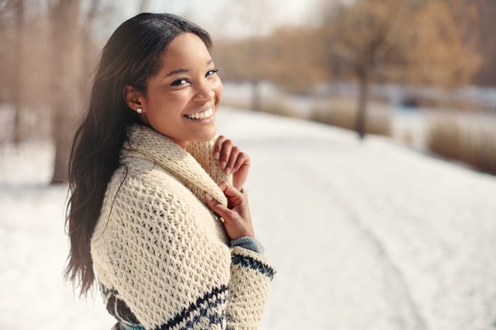 young woman happy snow outdoors