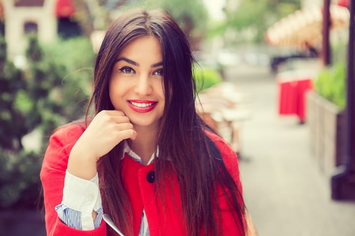 Portrait of a beautiful woman smiling outdoors