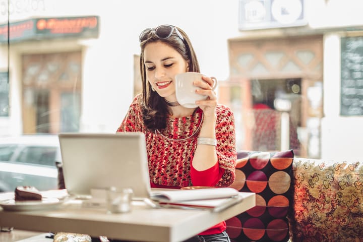 Young woman enjoying a cup of coffee on a rainy day