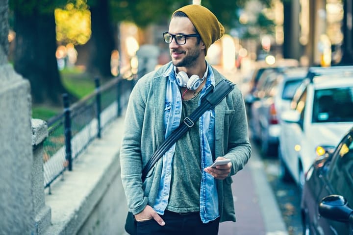 hipster man with phone in city