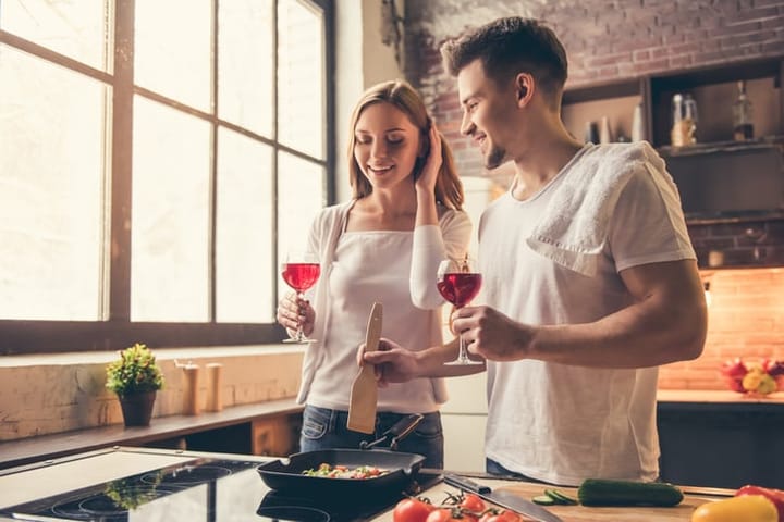 Beautiful couple cooking