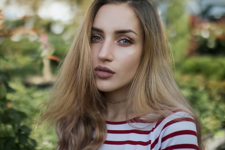 blonde woman facing camera