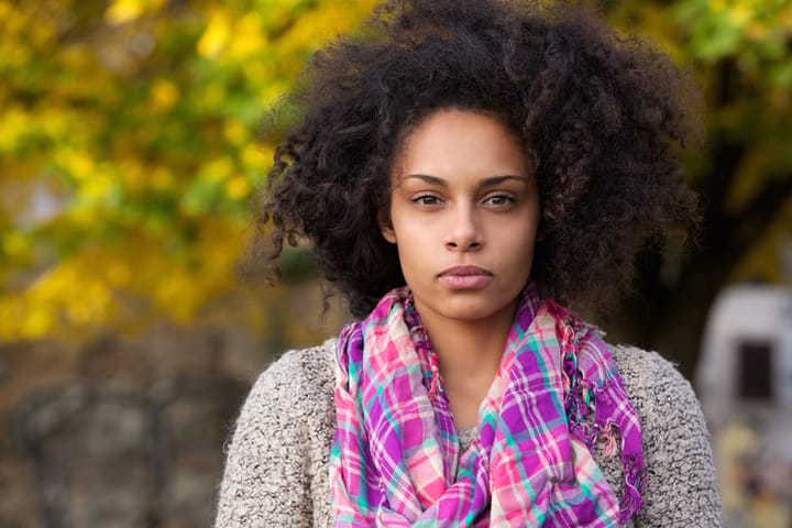 Beautiful young mixed race girl with afro hair