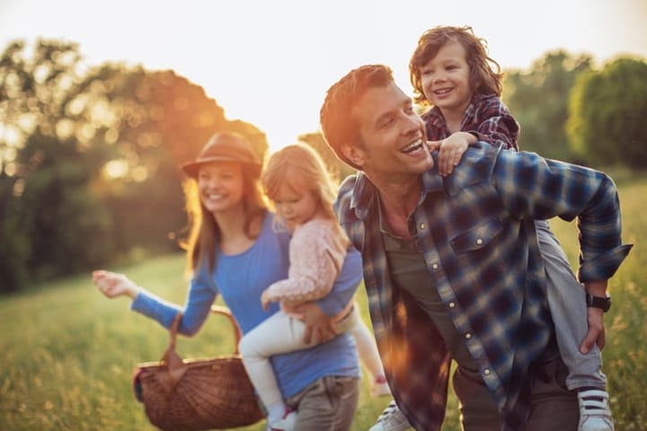 Photo of a happy family going for picnic