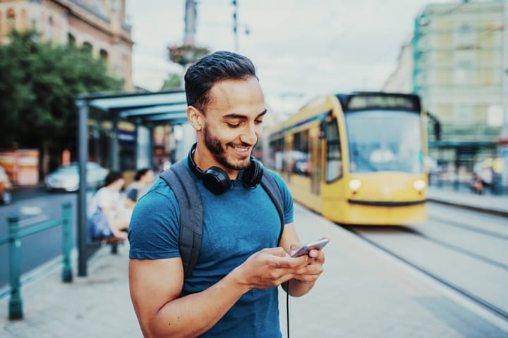 black man headphones neck mobile
