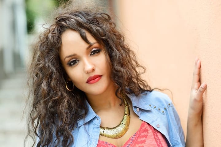 Attractive mixed woman in urban background