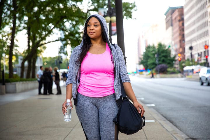 black woman in gymwear outside