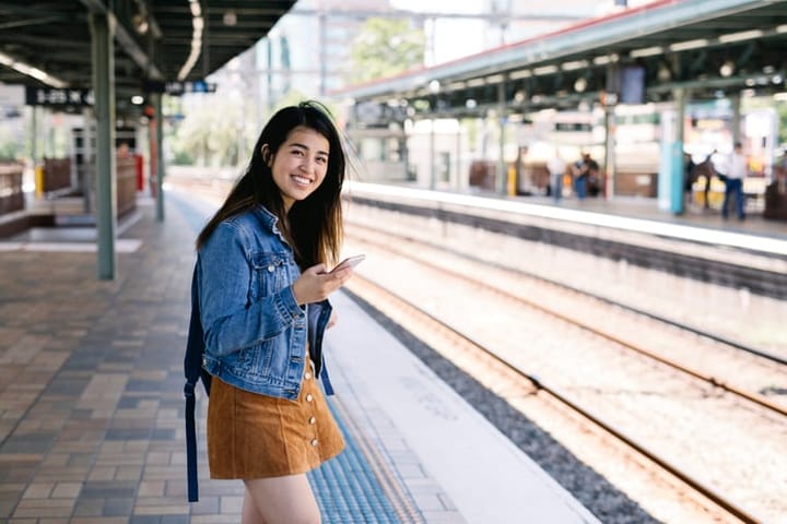 woman waiting for train at station
