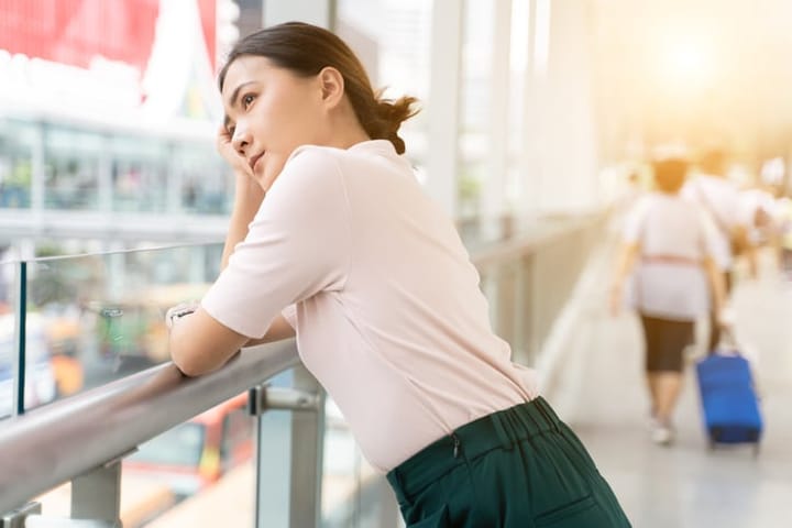 Sad woman standing in the city
