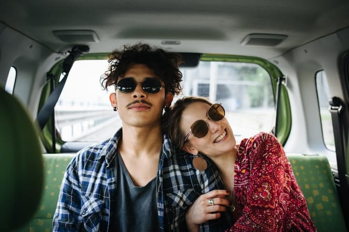 young adult couple in the car