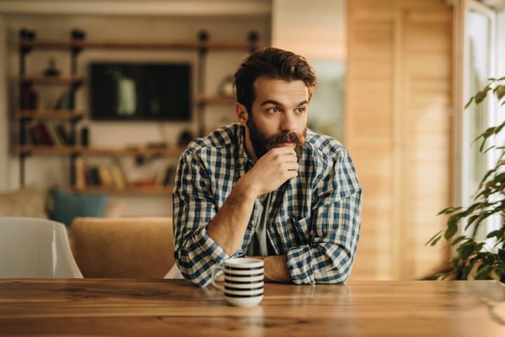 man with beard and coffee