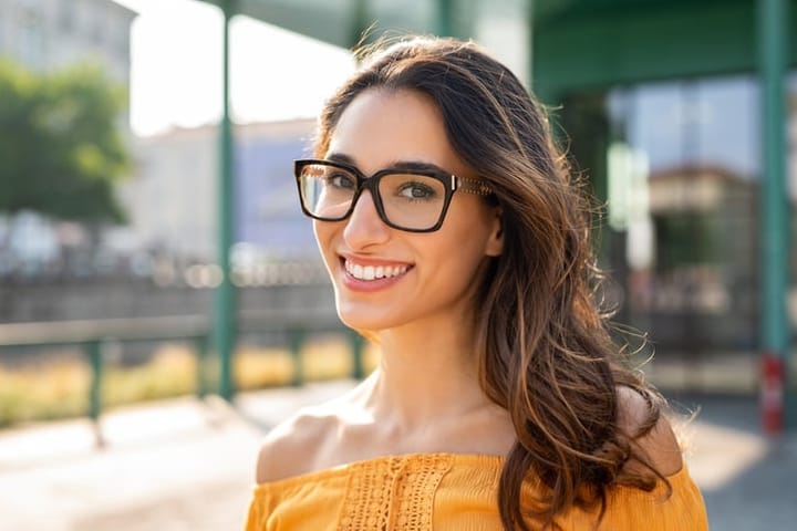 long haired brunette woman glasses
