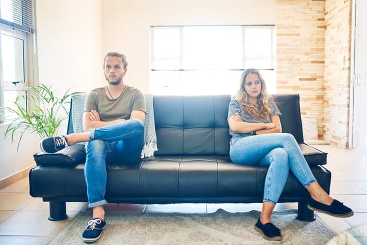 Shot of a young couple having a disagreement at home