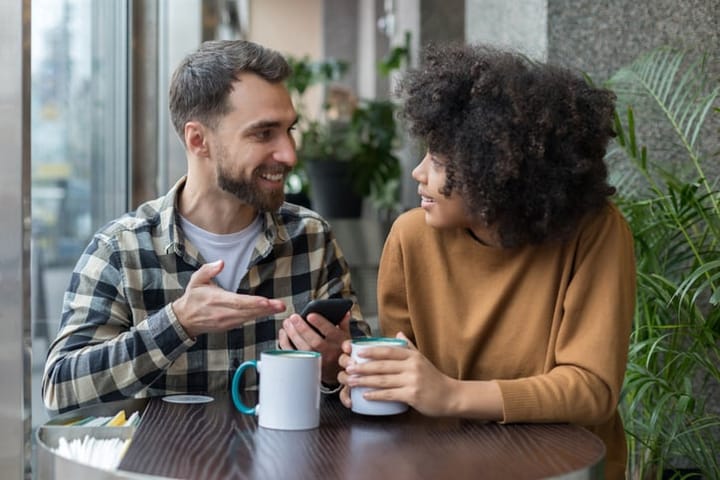 couple sitting having coffee together