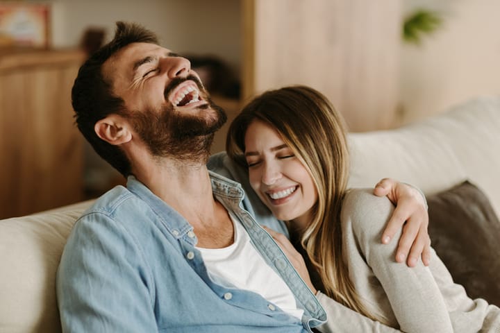 couple at home laughing