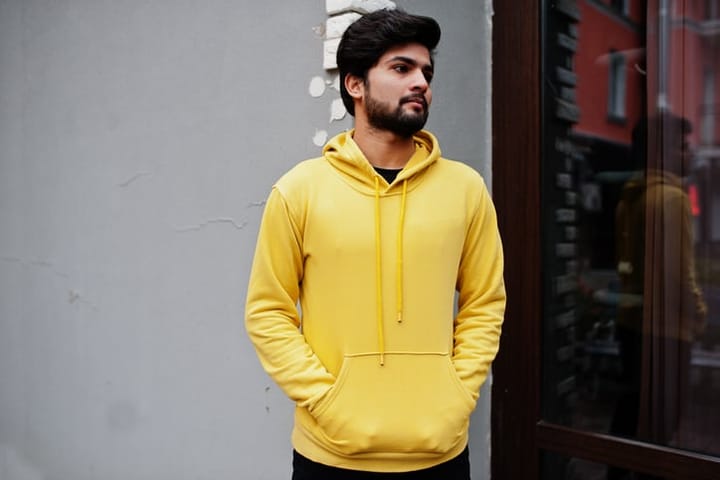 bearded man in yellow hoodie
