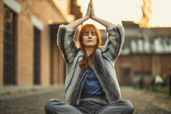 woman sitting doing a yoga pose