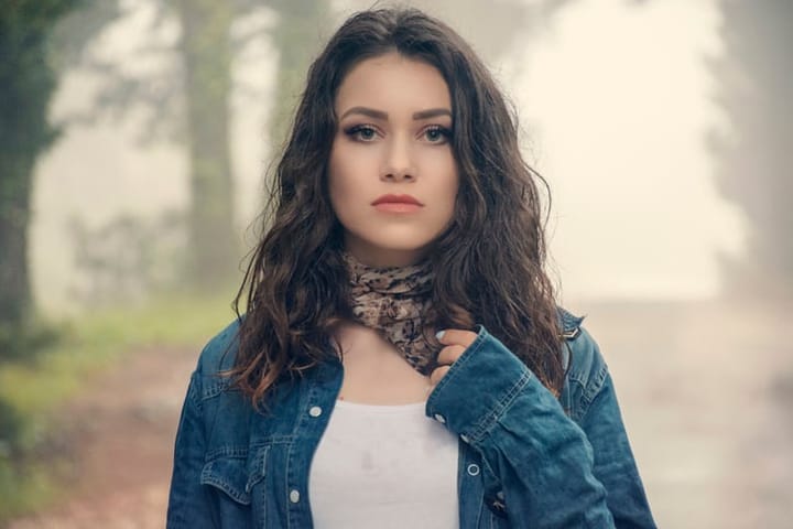 brunette woman outside cardigan