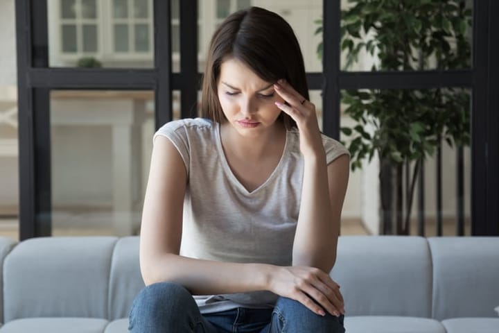 young woman sitting alone