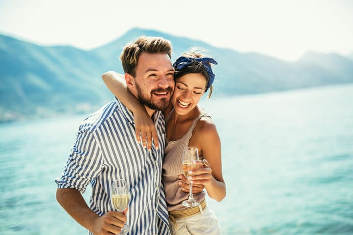 couple on vacation with wine
