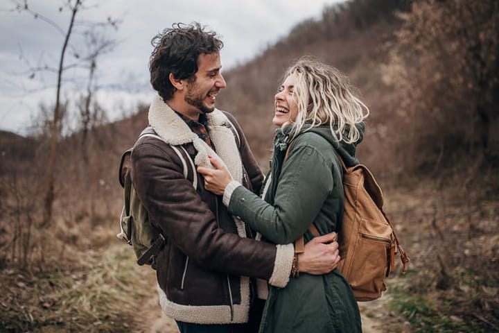 couple laughing wilderness